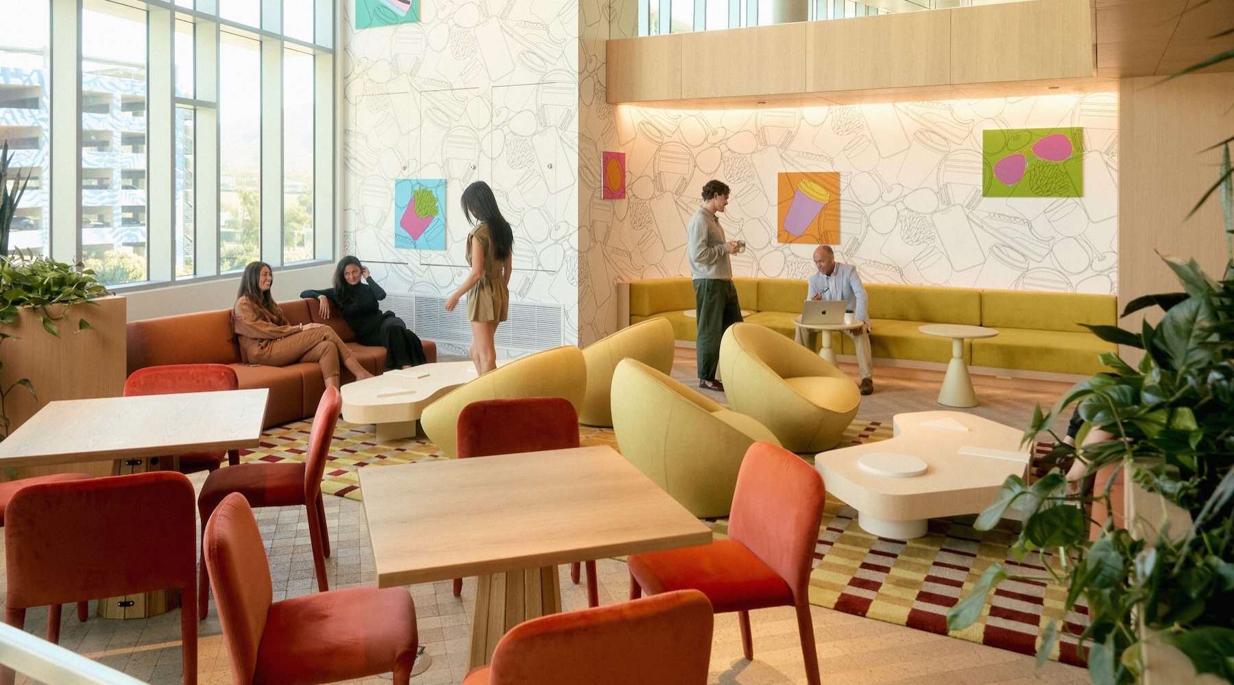 a lounge with seating and people talking